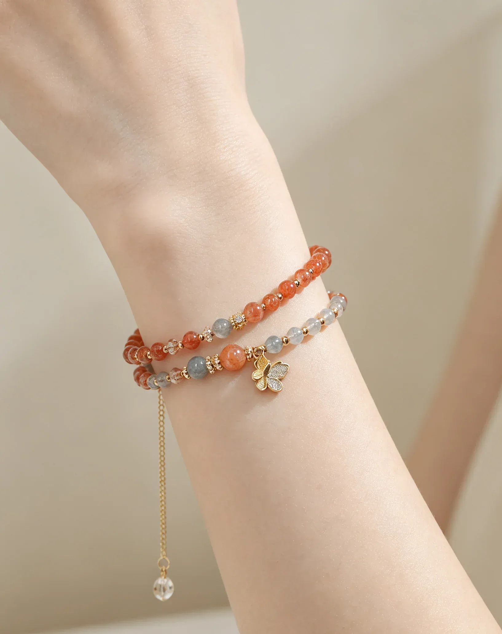 Layered natural crystal bracelets with gold butterfly charm, healing gemstone accessories for women