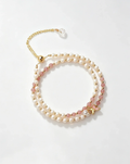Layered pearl and pink crystal bracelet with gold butterfly charm, natural gemstone accessory for women