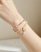 Elegant pearl and pink crystal bracelet set with butterfly charm, perfect for women's healing gemstone accessories.