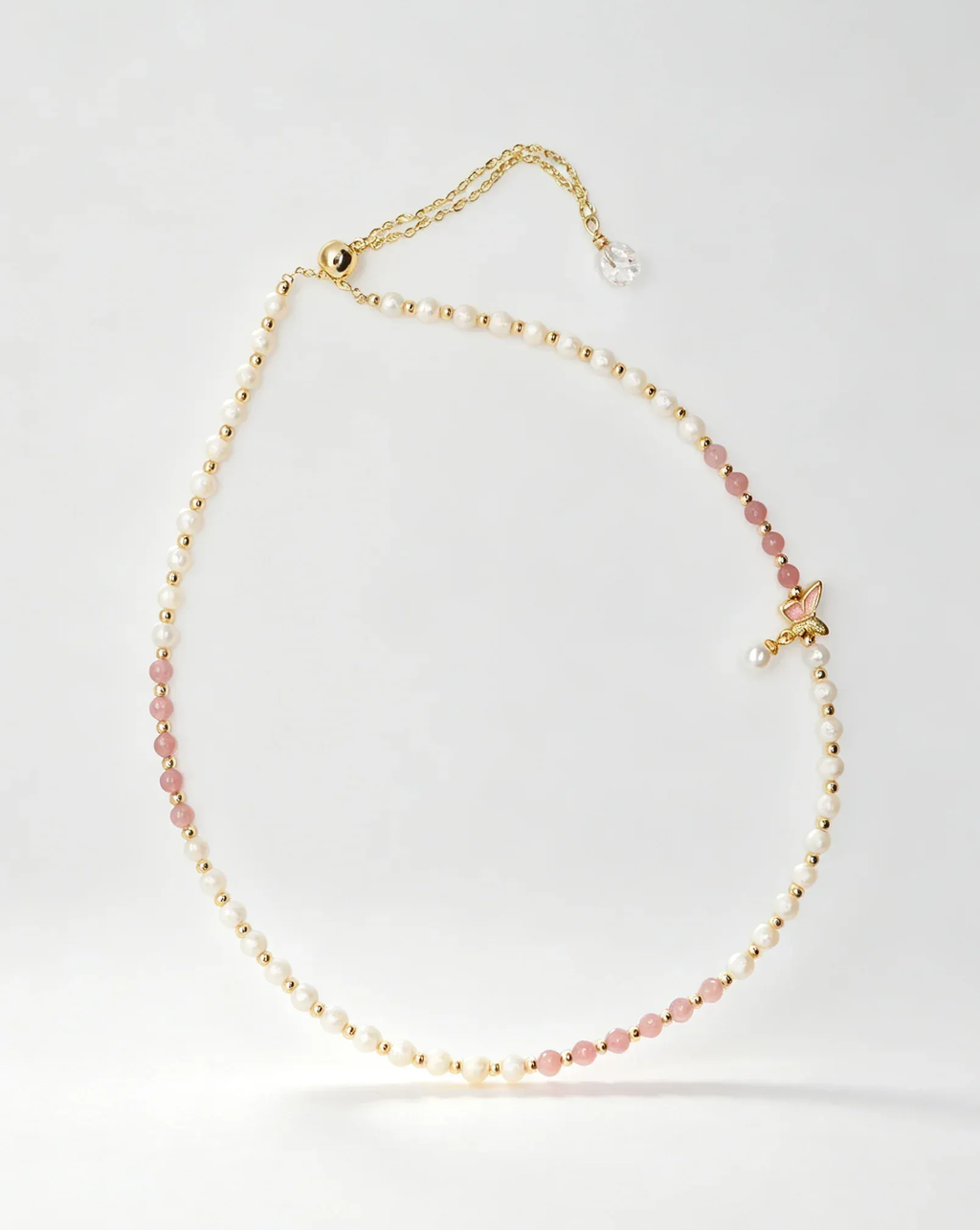 Delicate pearl and pink crystal necklace with gold chain and butterfly charm, natural gemstone jewelry for women