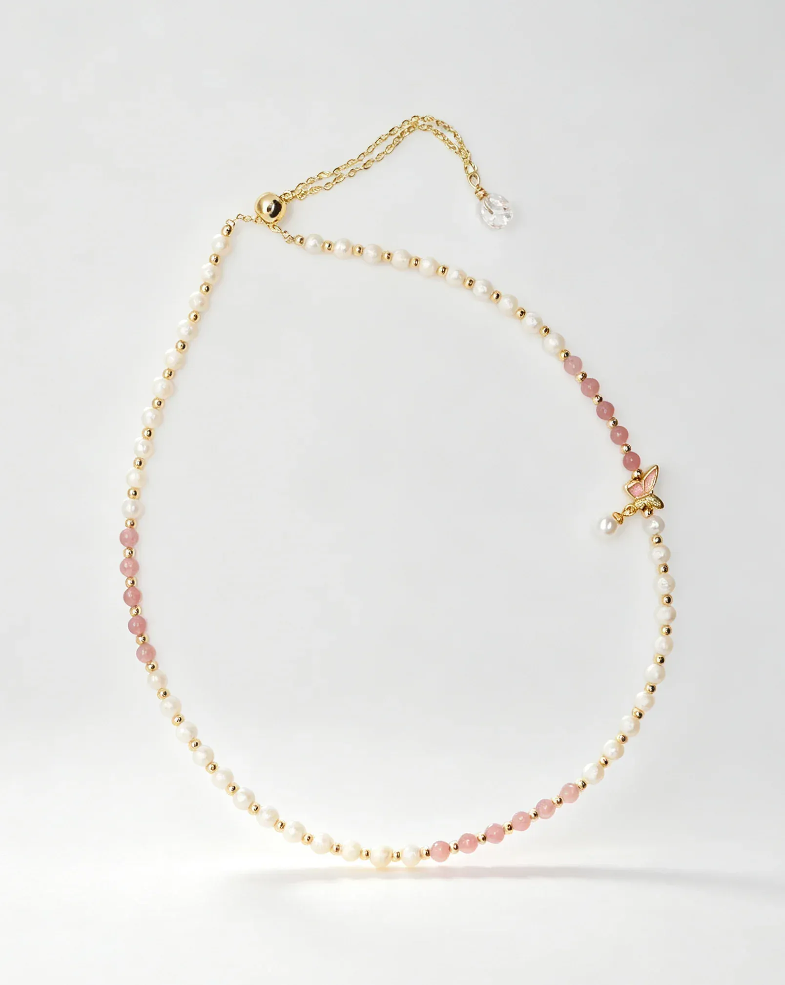 Delicate pearl and pink crystal necklace with gold chain and butterfly charm, natural gemstone jewelry for women