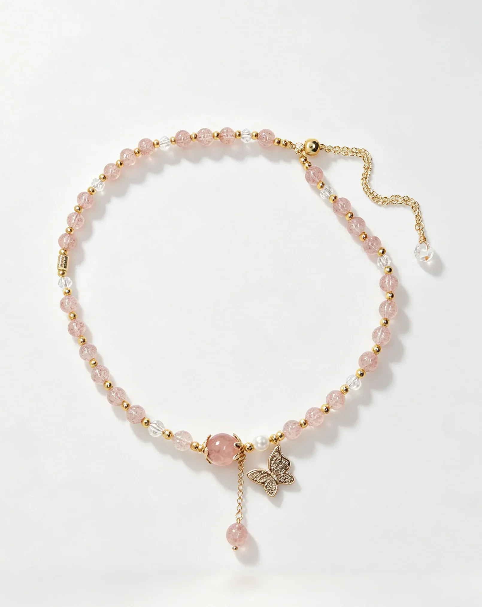 Pink crystal bracelet with gold butterfly charm, healing gemstone accessory for women