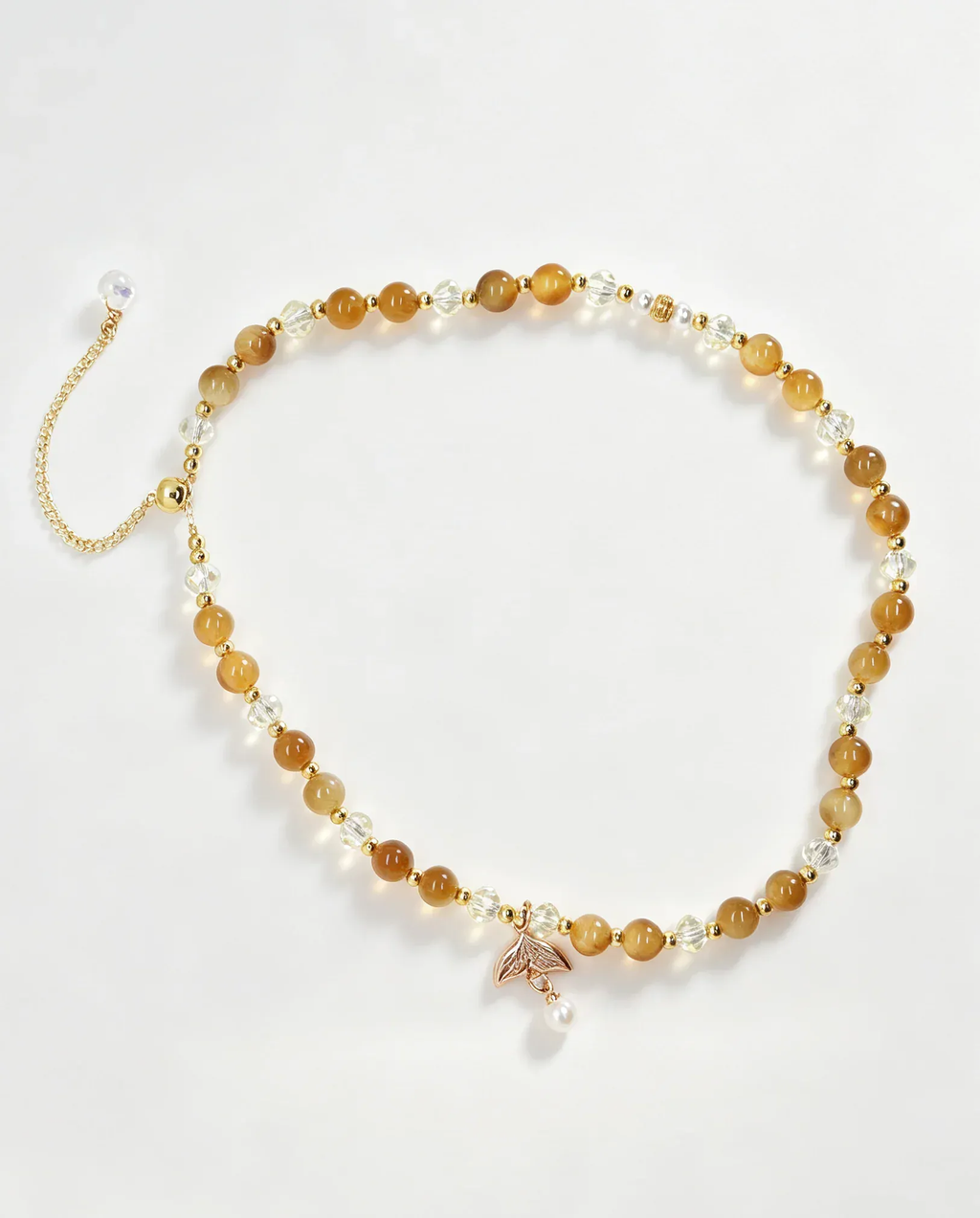 Handcrafted amber and crystal beaded bracelet with gold leaf charm, natural gemstone accessory for women
