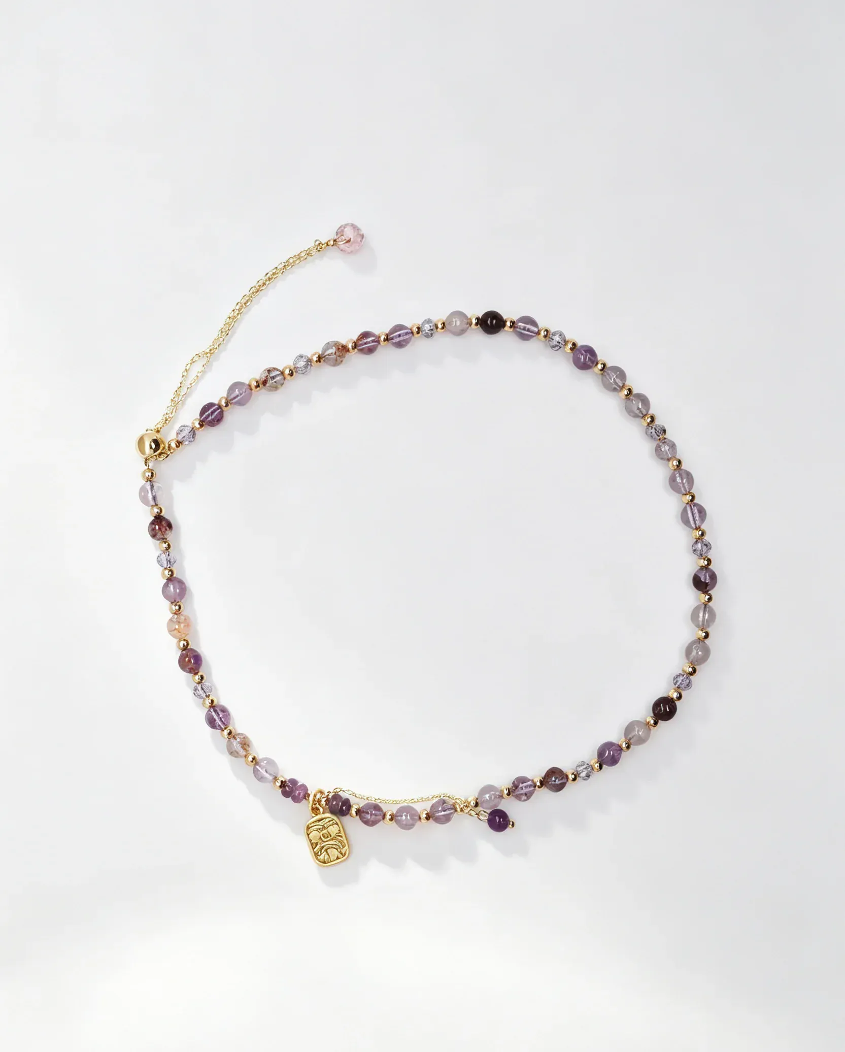 Purple crystal bracelet with gold charm, handcrafted healing gemstone accessory for women