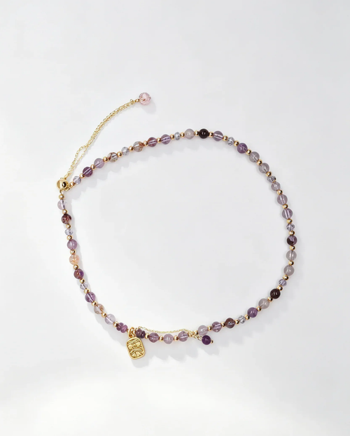 Purple crystal bracelet with gold charm, handcrafted healing gemstone accessory for women