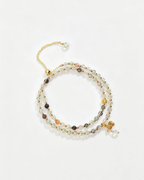Handcrafted natural crystal bracelet with gold accents and healing gemstones for positive energy