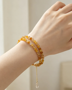 Layered amber crystal bracelet with gold chain charm, handcrafted healing gemstone accessory for women