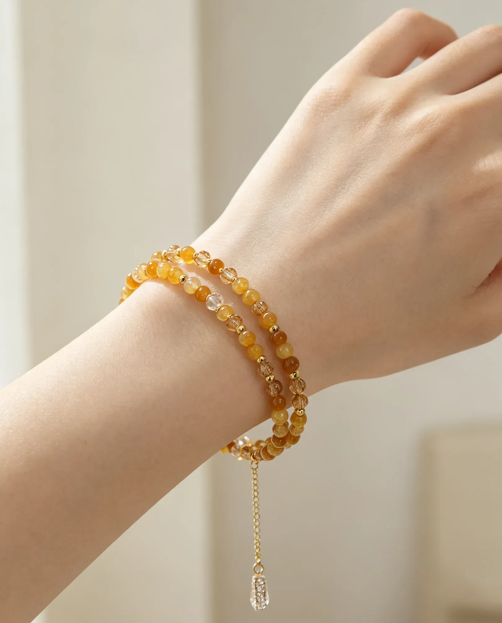 Layered amber crystal bracelet with gold chain charm, handcrafted healing gemstone accessory for women