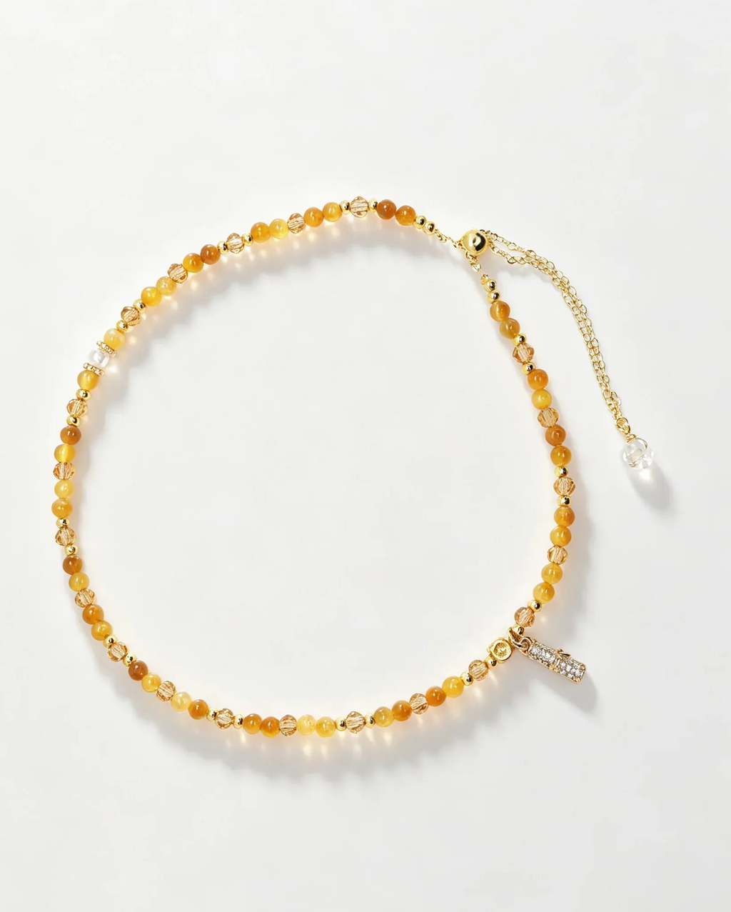 Handcrafted amber crystal bracelet with gold accents and adjustable chain, natural gemstone healing accessory for women