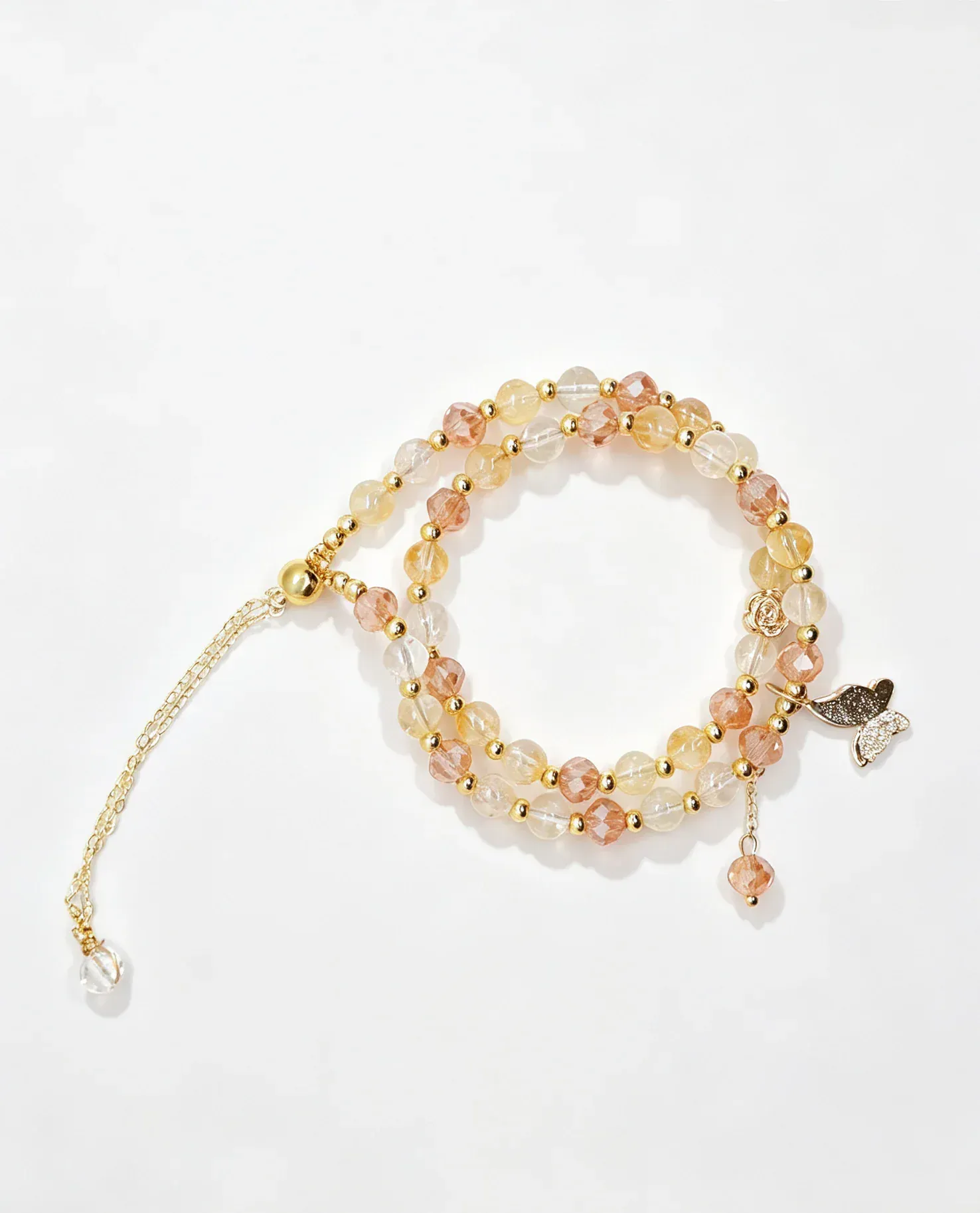 Handcrafted natural crystal bracelet with gold beads and butterfly charm, genuine healing gemstone accessory for women