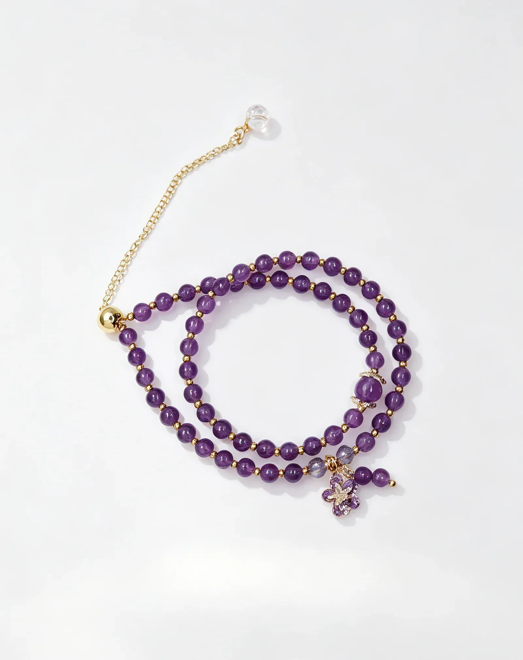 Purple amethyst crystal bracelet with gold chain and flower charm, natural gemstone healing accessory for women