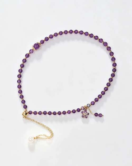 Purple amethyst crystal bracelet with gold chain and flower charm, healing gemstone accessory for women