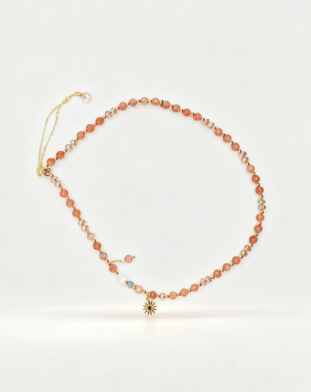 Handcrafted sunstone and crystal beaded necklace with gold star charm, natural gemstone jewelry for positive energy