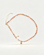 Handcrafted sunstone and crystal beaded necklace with gold star charm, natural gemstone jewelry for positive energy